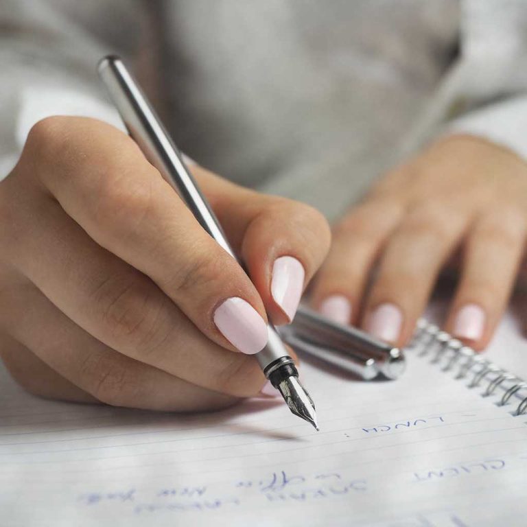 A woman writing in a journal